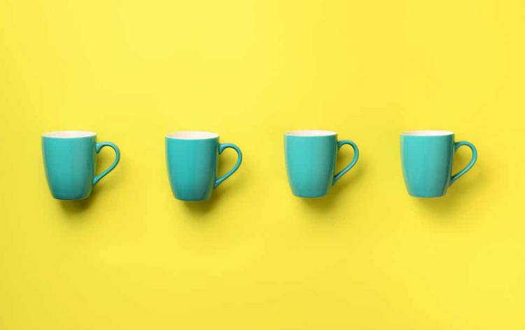Pattern from blue cups over yellow background birt XRZR