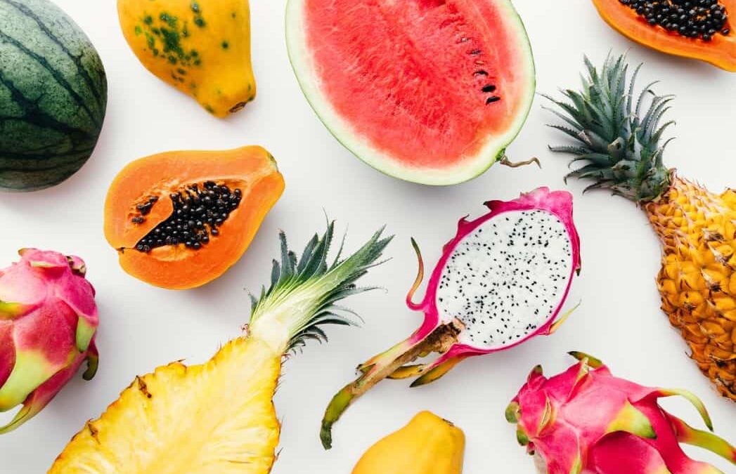 Flat lay tropical fruit layout made of dragon fruit watermelon papaya and pineapple creative summer t YVWGX